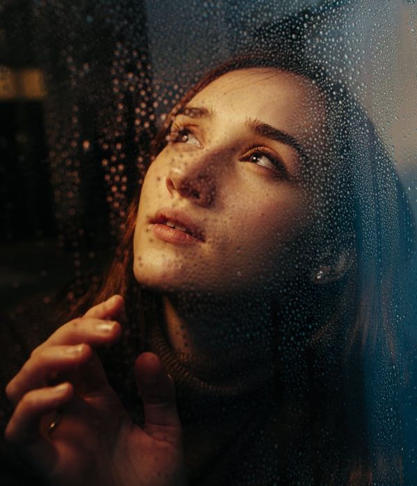 Young woman looking into the distance with clarity and peace.